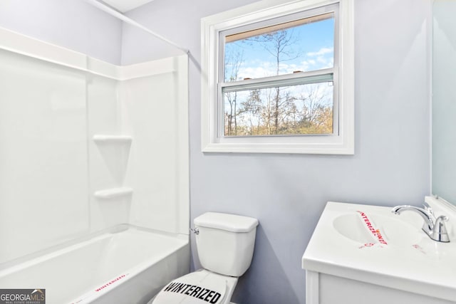 full bathroom with vanity, tub / shower combination, and toilet