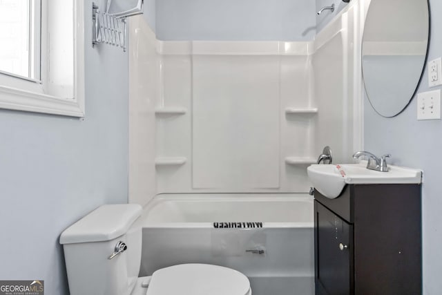 full bathroom featuring vanity, shower / washtub combination, and toilet