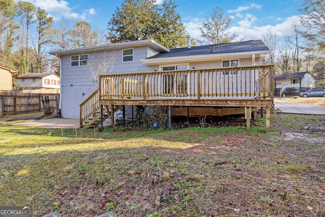 back of house featuring a wooden deck