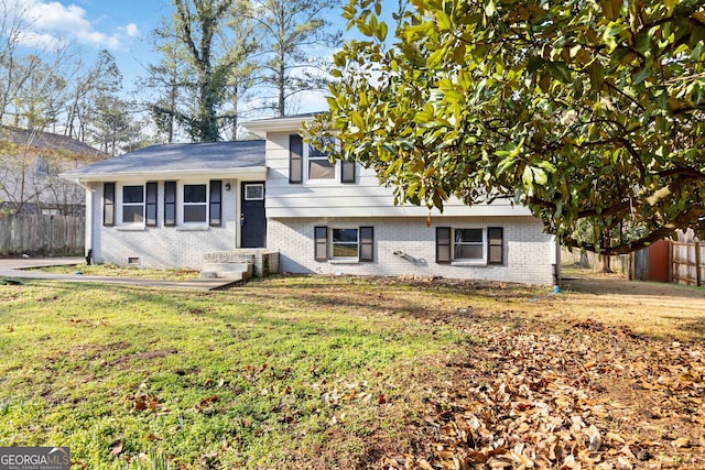 tri-level home featuring a front yard