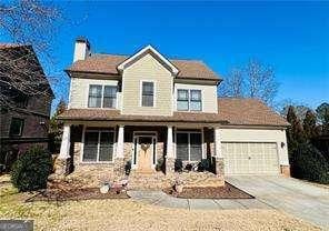 view of front facade with a garage and covered porch