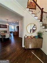 corridor featuring dark hardwood / wood-style flooring