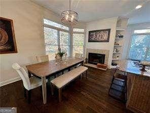 dining room featuring dark hardwood / wood-style floors and a notable chandelier