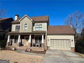 view of front of property with a garage and covered porch