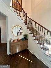 stairs with hardwood / wood-style flooring