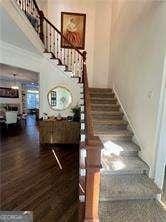 stairs with hardwood / wood-style floors