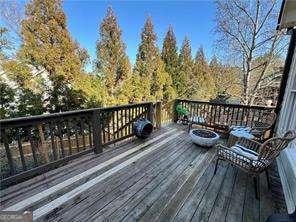 wooden deck with a fire pit