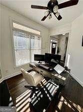 interior space featuring hardwood / wood-style floors and ceiling fan