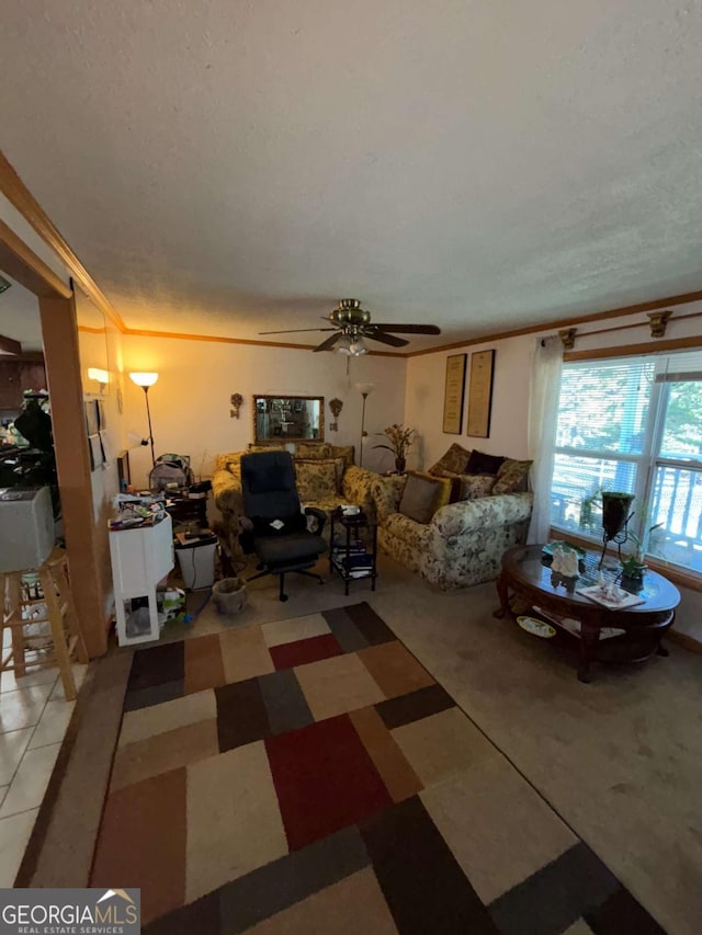 living room featuring ceiling fan and ornamental molding