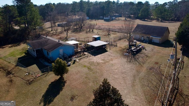 birds eye view of property featuring a rural view