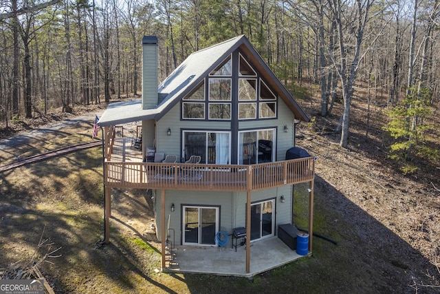 rear view of property featuring a patio