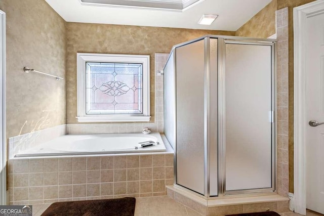 bathroom featuring separate shower and tub