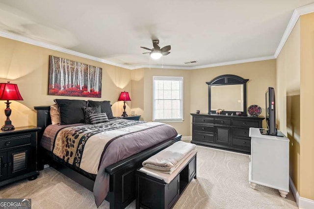 bedroom with crown molding, light colored carpet, and ceiling fan