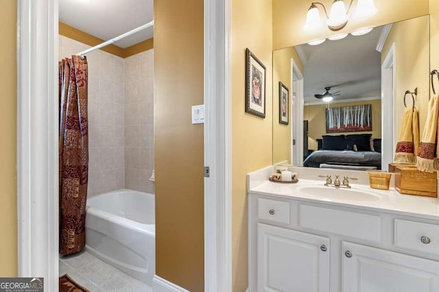 bathroom featuring tile patterned flooring, shower / bath combo, vanity, and ceiling fan