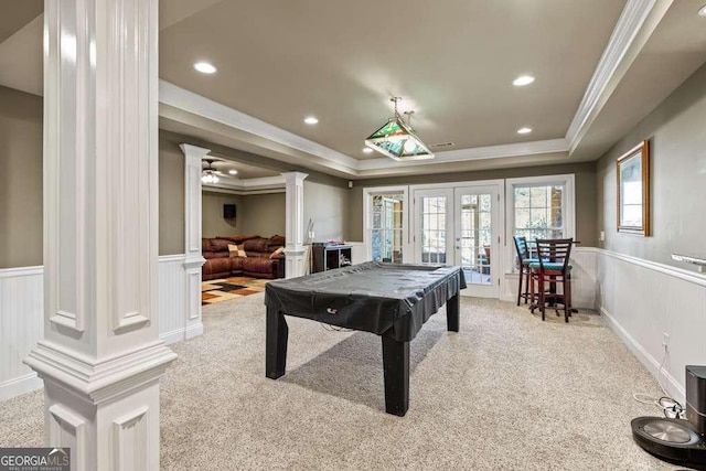 rec room featuring decorative columns, a tray ceiling, pool table, light colored carpet, and french doors