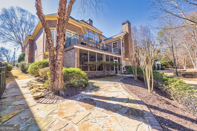 back of property with a balcony