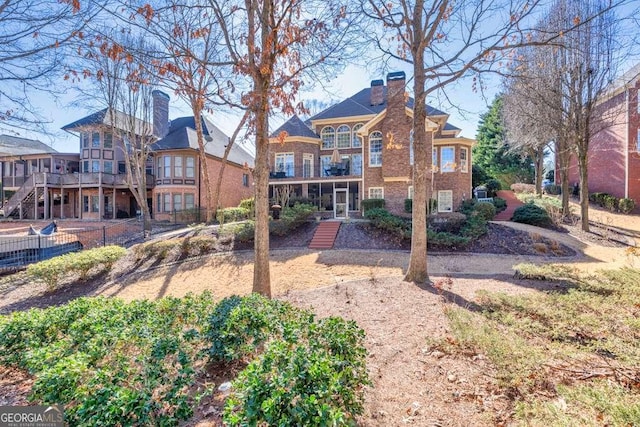 back of property featuring a balcony