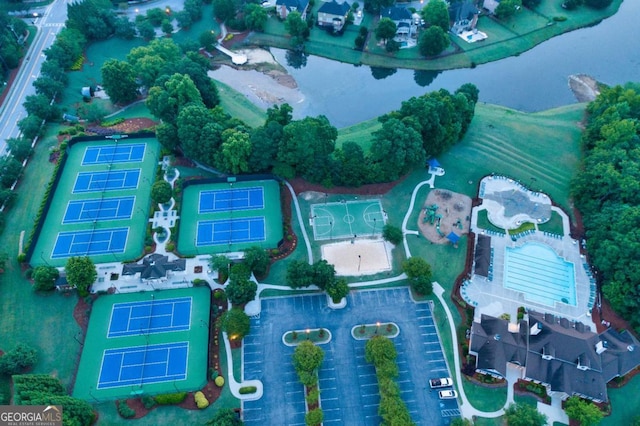 birds eye view of property with a water view