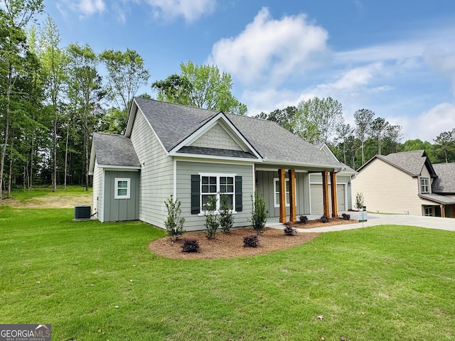 25 Patterson Dr, Franklin, GA 30217 - view of front of home featuring board and batten siding, a front yard, covered porch, roof with shingles, and cooling unit