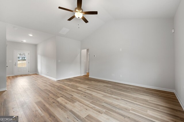 25 Patterson Dr, Franklin, GA 30217 - unfurnished living room with a ceiling fan, light wood-style floors, vaulted ceiling, baseboards, and recessed lighting