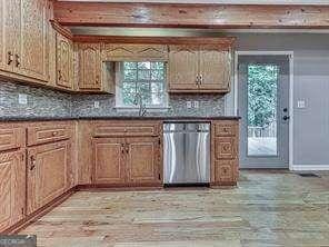 kitchen featuring sink, decorative backsplash, light hardwood / wood-style floors, and dishwasher