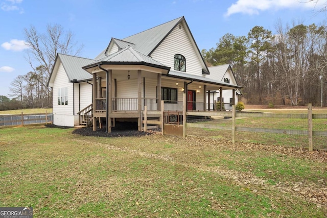 view of front facade with a front yard and a porch