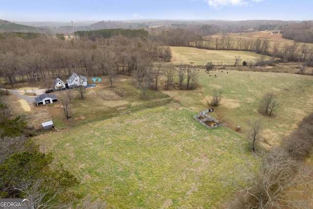 birds eye view of property featuring a rural view