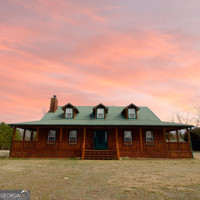 view of front of home with a lawn