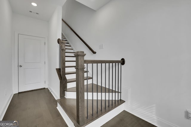 staircase featuring hardwood / wood-style floors