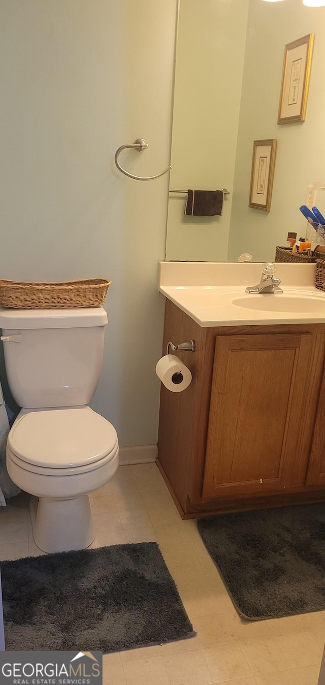 bathroom with vanity and toilet