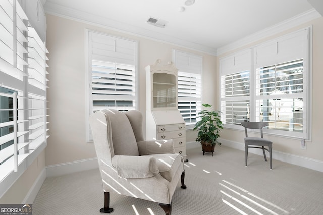 living area with light colored carpet and ornamental molding