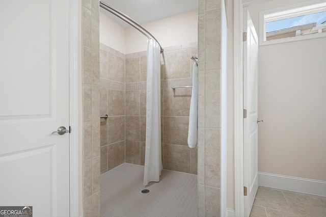 bathroom featuring a shower with curtain and tile patterned floors