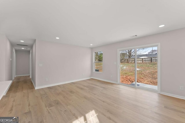 empty room with light hardwood / wood-style floors