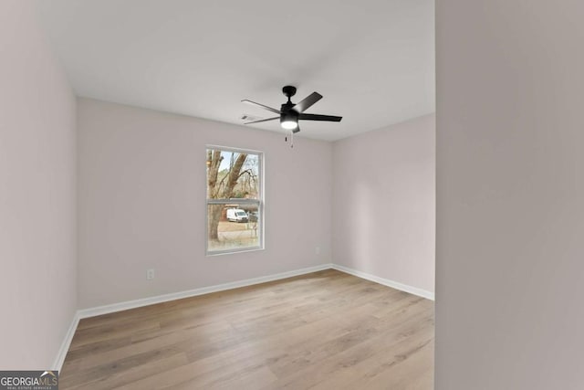 spare room featuring ceiling fan and light hardwood / wood-style flooring