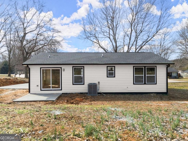 rear view of property featuring a patio and central air condition unit