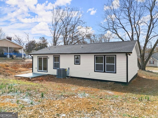 rear view of property featuring a patio area and central air condition unit