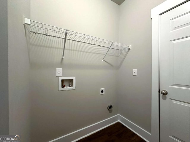 washroom with hookup for an electric dryer, dark hardwood / wood-style flooring, and hookup for a washing machine