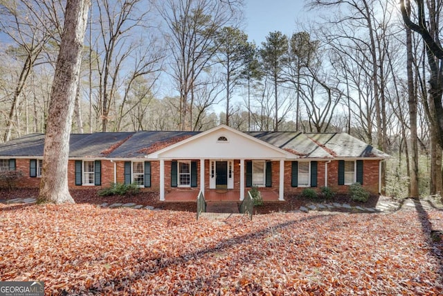 ranch-style home featuring a porch