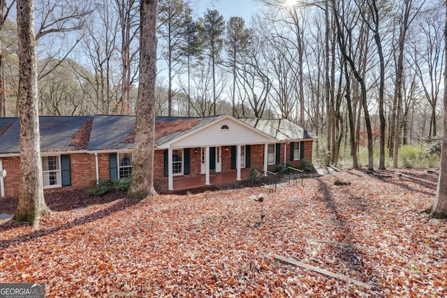 single story home featuring a porch