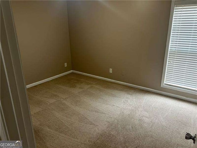 unfurnished room with carpet floors