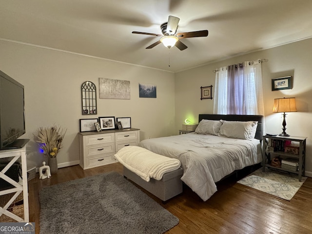 bedroom with dark wood-type flooring and ceiling fan