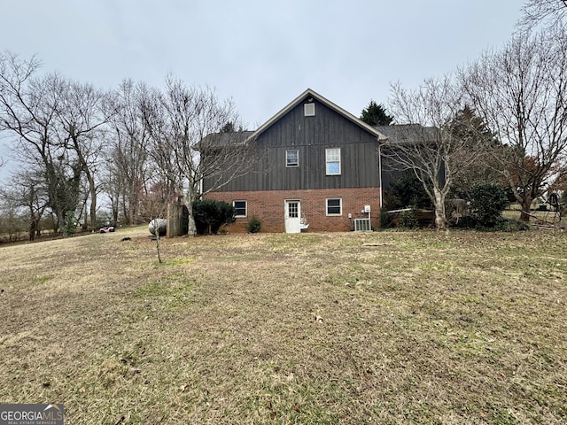 view of property exterior featuring a lawn