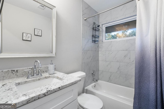 full bathroom featuring vanity, toilet, and shower / bath combo with shower curtain