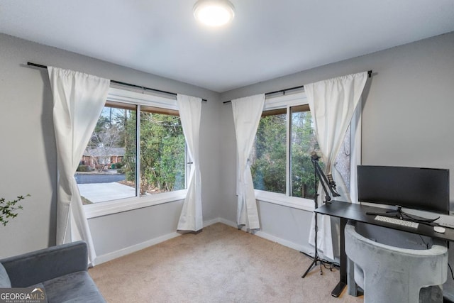 home office with light carpet and a wealth of natural light