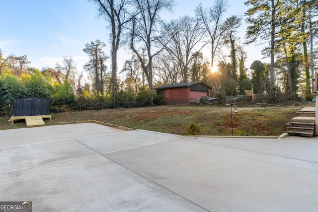 patio terrace at dusk with a storage shed