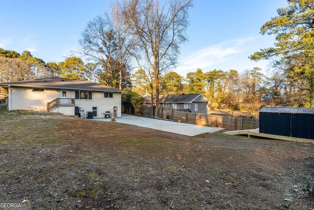 back of house with a patio area