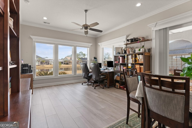 office area featuring ornamental molding, ceiling fan, and light wood-type flooring