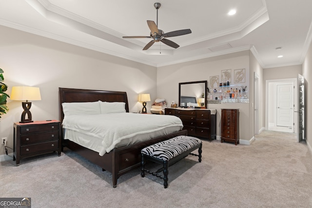 bedroom with light carpet, ornamental molding, a raised ceiling, and ceiling fan