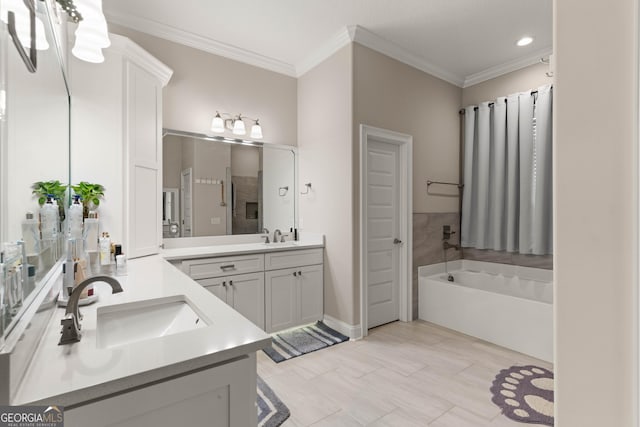 bathroom with vanity, a bath, and crown molding