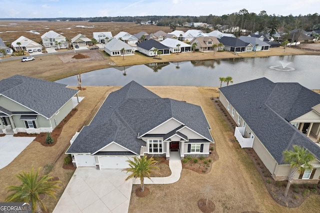 drone / aerial view with a water view